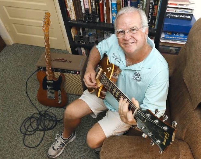 Tim Pospichal, Auburndale mayor and retired professional musician, with his 1968 Gibson Les Paul Deluxe at home in Auburndale.