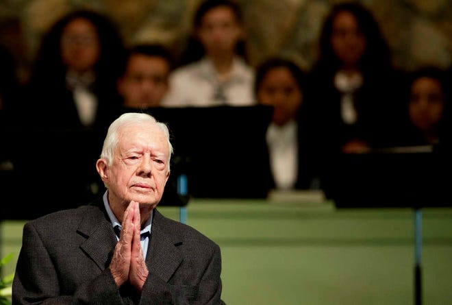 Former President Jimmy Carter teaches Sunday School class at Maranatha Baptist Church in his hometown Sunday, Aug. 23, 2015, in Plains, Ga. The 90-year-old Carter gave one lesson to about 300 people filling the small Baptist church that he and his wife, Rosalynn, attend. It was Carter's first lesson since detailing the intravenous drug doses and radiation treatment planned to treat melanoma found in his brain after surgery to remove a tumor from his liver. (AP Photo/David Goldman)
