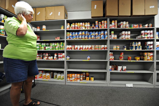Dottie Rimmer, coordinator for the Food Larder at New Britain Baptist Church looks at the dwindling food supply on Friday, July 31, 2015. The pantry runs low on non-perishable items during the summer. Lots of giving of those items during winter, especially Thanksgiving/Christmas. Not so much during summer, but need is still there.