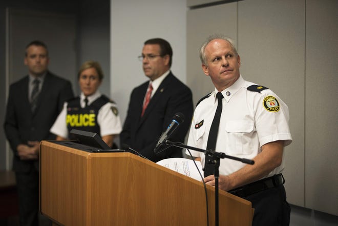 Toronto Police Services Superintendent Bryce Evans, right, speaks to the media regarding the investigation into the AshleyMadison.com breach during a press conference in Toronto on Monday. The hack of the cheating website Ashley Madison has triggered extortion crimes and led to two unconfirmed reports of suicides, Canadian police said Monday. The company behind Ashley Madison is offering a $500,000 Canadian (US $378,000) reward for information leading to the arrest of members of a group that hacked the site. Melissa Renwick/Toronto Star, The Canadian Press via AP