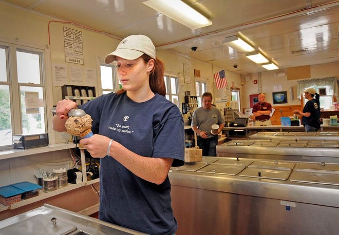 A file photo from 2012 of Erin Moore, 16, a summertime employee, scooping a cone at the Crescent Ridge dairy bar in Sharon.