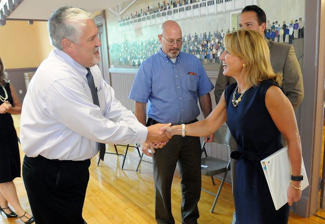 Selectman Jim Brochu greets Lt. Gov. Karyn Polito during a meeting with town officials in Upton, Tuesday. Daily News Staff Photo/John Thornton