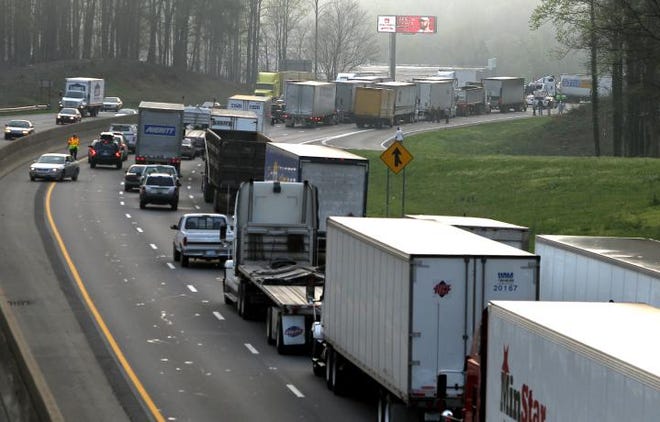 (John Clark/The Gazette) Traffic on I-85 North sits at a standstill after this March 2012 tractor-trailer wreck near Exit 23 in Gaston County. Local leaders hope that widening the interstate with an additional lane in either direction would alleviate congestion on the heavily traveled highway.