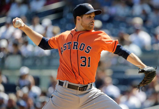 Houston Astros' Collin McHugh (31) delivers a pitch during the first inning of a baseball game against the New York Yankees Wednesday, Aug. 26, 2015, in New York. (AP Photo/Frank Franklin II)