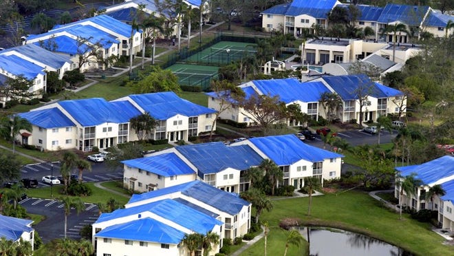 Blue tarps cover storm-damaged roofs near Northwood University during the devastating 2004 hurricane season.