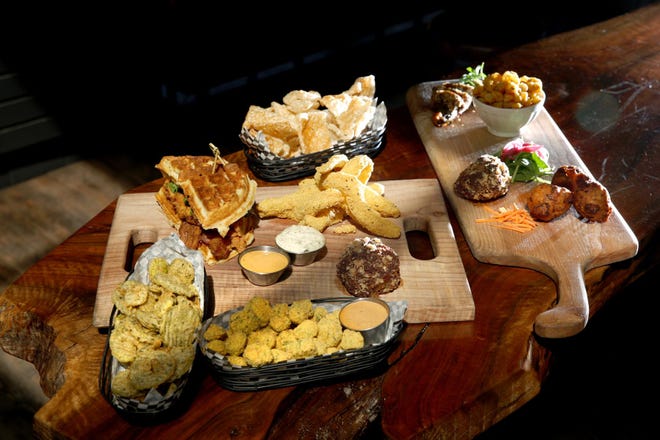 Elk Horn Brewery in Eugene has a menu filled with Southern-style fried delicacies, from pickles (“frickles”), lower left, to made-to-order pork skins, middle top, to hushpuppies, far right. (Collin Andrew/The Register-Guard)