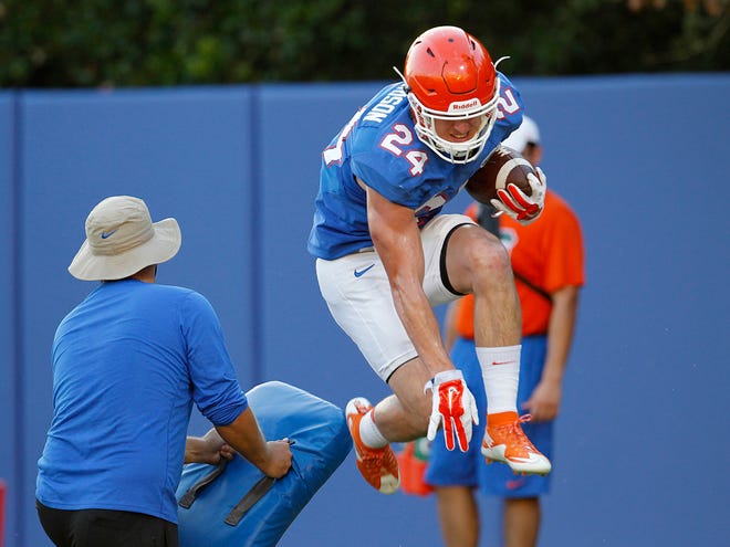 Florida running back Case Harrison performs a drill during practice Tuesday.