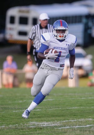 Asheboro's Terry Richmond 60 yard touchdown run against Randleman during the first half at Charles R. Gregory Stadium on August 21,2015. PJ Ward-Brown/The Courier-Tribune