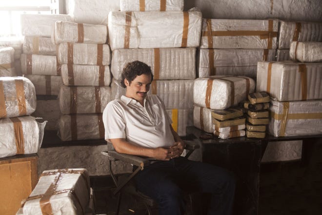 This undated production photo provided by Netflix, shows actor Wagner Moura as Pablo Escobar, in the Netflix Original Series "Narcos." The biopic promises to be an authentic portrayal of Escobar, so it's only natural that Brazilian director and executive producer Jose Padilha chose to film the 10-episode series in Medellin, the murder capital of the world during the drug kingpin's heyday in the 1980s. (Daniel Daza/Netflix via AP)