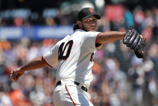 San Francisco Giants pitcher Madison Bumgarner (40) throws against the Chicago Cubs during the first inning of a baseball game in San Francisco, Thursday, Aug. 27, 2015. (AP Photo/Jeff Chiu)