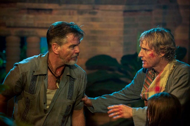 In this image released by The Weinstein Company, Pierce Brosnan, left, and Owen Wilson appear in a scene from, "No Escape."