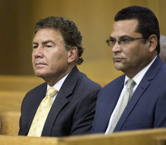 Tony Iorio, vice president of AV Homes, left, and Mark Maldonado, Association of Poinciana Villages manager, listen to testimony in court in Bartow on Friday in a case involving a lawsuit over the location of Association of Poinciana Villages' funds and documents relating to an ongoing dispute between residents and management.
