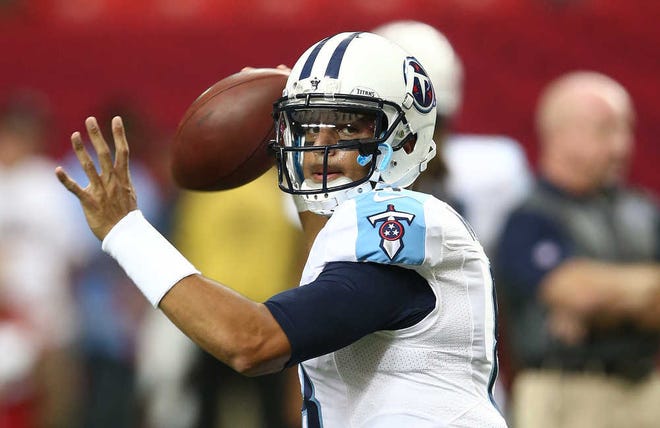FILE - In this Aug. 14, 2015, file photo, Tennessee Titans quarterback Marcus Mariota warms up before an NFL football preseason game against the Atlanta Falcons in Atlanta. Tennessee rookie quarterback Marcus Mariota finally is ready for his home debut this preseason. It won't be easy against the St. Louis defense in a nationally televised game Sunday night, Aug. 23, 2015. (AP Photo/John Bazemore, File)