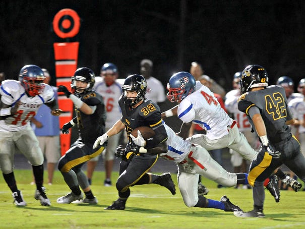 Topsail RB Grant McCoy (32) moves the ball upfield Friday night at home against Pender. Photo by Jeff Reid/StarNews