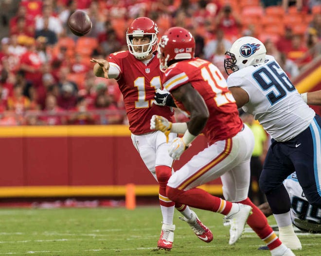 Kansas City quarterback Alex Smith throws a pass to wide receiver Jeremy Maclin during the first half of Friday's game against the Tennessee Titans at Arrowhead Stadium.