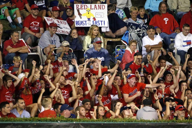 Fans of the team from Lewisberry, Pennsylvania, cheer from the hillside overlooking the outfield of Lamade Stadium during Wednesday's game between Lewisberry and Pearland, Texas, at the Little League World Series. The Associated Press