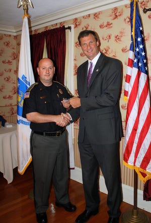 Worcester County Sheriff Lew Evangelidis congratulates and presents Robert Crandall, of Hopedale, with his gold bars in recognition of his recent promotion to the rank of lieutenant at the Worcester County Sheriff's Office. CONTRIBUTED PHOTO
