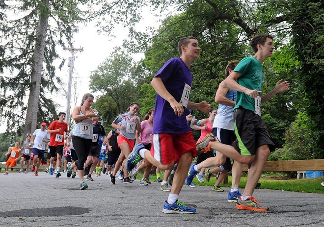 Runners leave the starting line during the Fourth Annual Kicking Butt for Crohn's Disease 5K in Shrewsbury, last Saturday. Wicked Local Staff Photo/ John Thornton