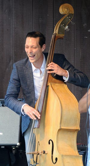 Christopher Davis-Shannon plays bass during the Pinelands Jazz Festival Saturday at Camp Ockanickon in Medford.