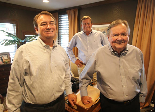 Adams, Cameron & Co. Realtors, the largest real estate brokerage in Volusia and Flagler counties, is still a family-run business. Bob Admas, right, is president and CEO. His son John Adams, left, is general manager and his other son, Ryan Adams, is a top salesman. News-Journal/JIM TILLER