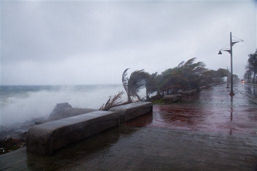 Strong winds and waves batter the coast as tropical storm Erika approaches Santo Domingo, Dominican Republic, Friday, Aug. 28, 2015. Tropical Storm Erika began to lose steam Friday over the Dominican Republic, but it left behind a trail of destruction that included several people killed on the small eastern Caribbean island of Dominica, authorities said. (AP Photo/Tatiana Fernandez)