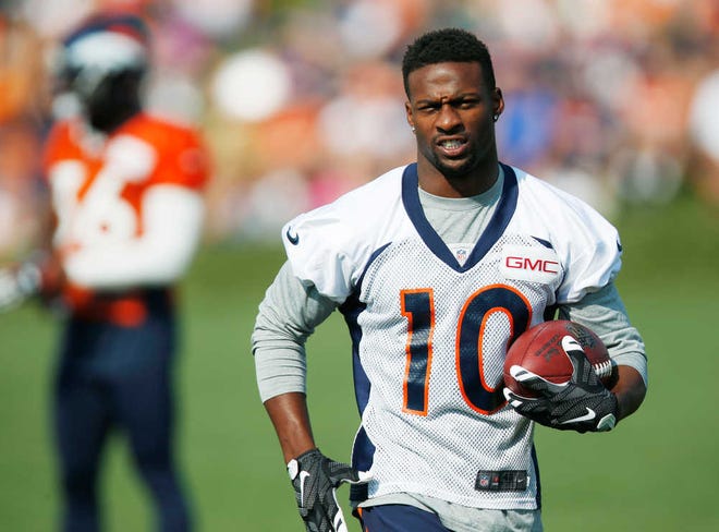 Denver Broncos wide receiver Emmanuel Sanders catches a pass during the team's NFL football training camp session early Thursday, Aug. 20, 2015, in Englewood, Colo. (AP Photo/David Zalubowski)