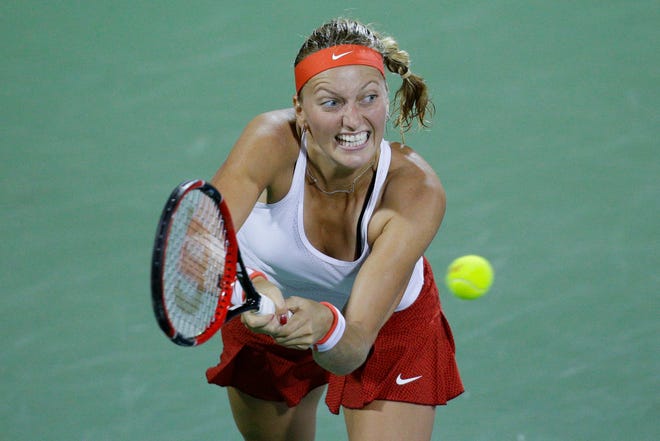 In this Aug. 19, 2015, file photo, Petra Kvitova, of the Czech Republic, returns to Caroline Garcia, of France, during a match at the Western & Southern Open tennis tournament in Mason, Ohio. Kvitova beat Serena Williams in Madrid this year.
