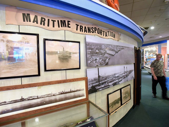 A display inside the Jacksonville Maritime Heritage Center showing historic photographs of Jacksonville's waterfront activity.