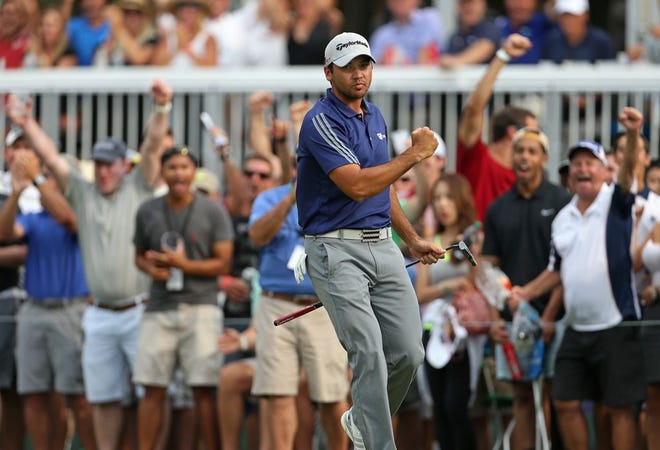 Jason Day, of Australia, reacts after hitting a birdie putt on the 15th green during the final round of play at The Barclays golf tournament Sunday, Aug. 30, 2015, in Edison, N.J. (AP Photo/Adam Hunger)