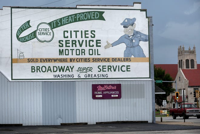 One of the many "walldog" murals in the downtown Lincoln business district features an reproduction advertisment for the long defunct Cities Service brand of motor oil sold by the former Broadway Super Service filling station once located at 413 Broadway in Lincoln. The mural can be seen on the side of a building housing McEntire's Direct Maytag business at 403 Broadway in Lincoln. David Spencer/The State Journal-Register
