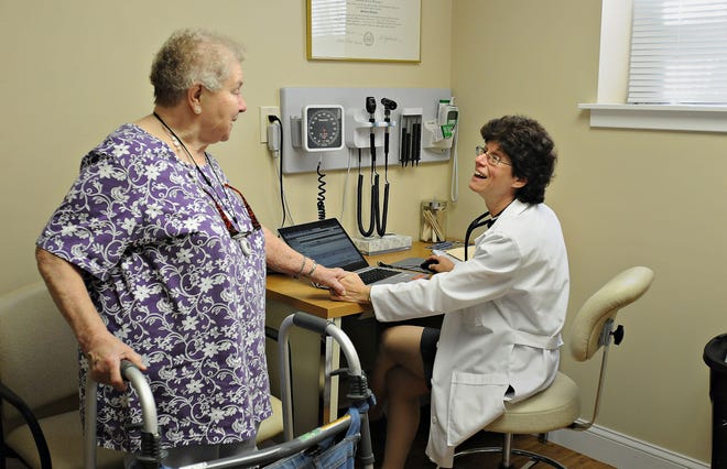 Dr. Audrey Kleeman (right) says goodbye to her longtime patient Shirley Pastorella after an office visit. "I've always just wanted to truly be a doctor, and not be concerned with the business aspect of the practice of medicine," said Kleeman, who has worked for hospitals for her entire career and joined St. Mary Medical Center in Middletown in January.