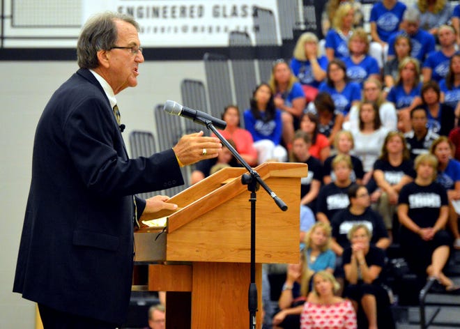 Former University of Michigan football coach Lloyd Carr speaks to a crowd of West Ottawa Public Schools teachers, staff and administrators Tuesday, Sept. 1, 2015, as a part of the opening day rally at West Ottawa High School's north gym. Amy Biolchini/Sentinel Staff