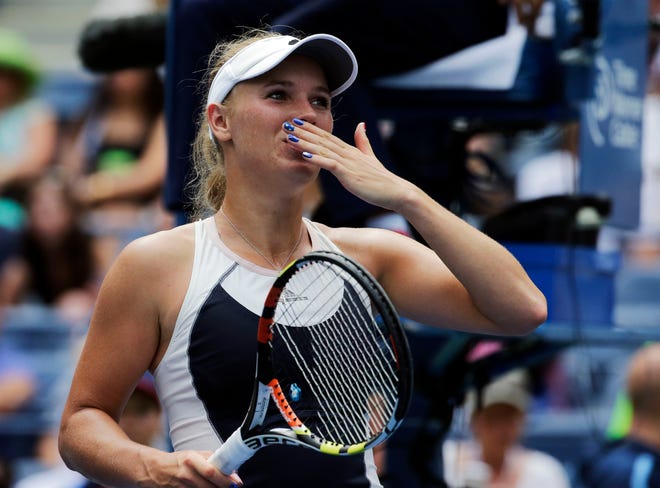 Caroline Wozniacki blows kisses to the crowd after beating Jamie Loeb in the first round of the U.S. Open. The Associated Press