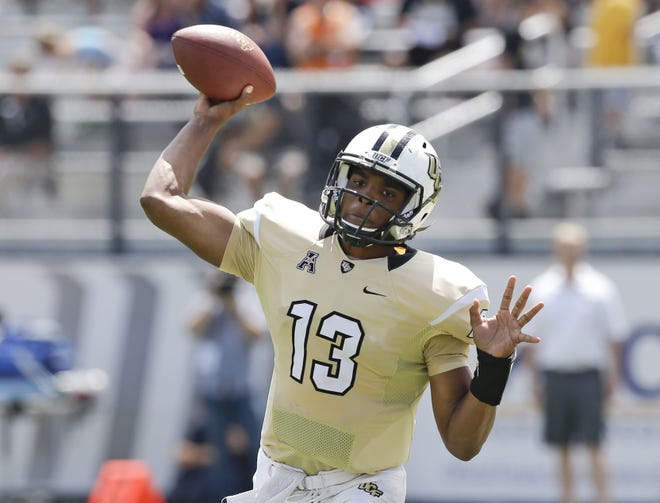Junior quarterback Justin Holman is back for his second full season as UCF's starter. He is coming off a year that saw him throw for 2,952 yards and 23 touchdowns. ASSOCIATED PRESS/JOHN RAOUX