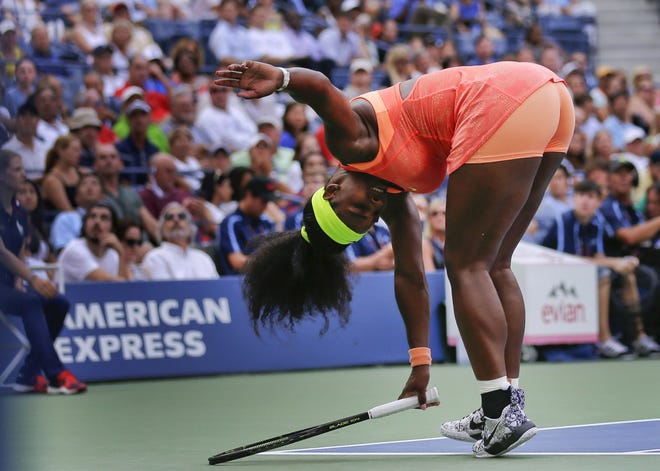 Serena Williams loses her balance after returning a shot to Kiki Bertens. THE ASSOCIATED PRESS