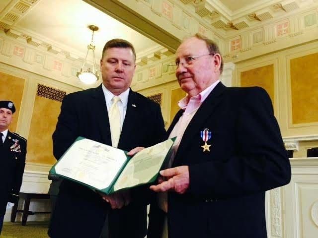 John Lyon • Arkansas News Bureau
U.S. Rep. Rick Crawford, R-Jonesboro, left, and James Smith of Star City participate in a Silver Star medal ceremony at the state Capitol on Tuesday, Sept. 1, 2015. Crawford presented Smith with a belated Silver Star for gallantry in action in the Vietnam War.