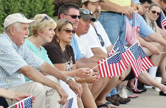 TIMES RECORD FILE PHOTO   Fort Smith resident Curtis Sorrells, left, and others attend a rally supporting Southside High School's Rebel mascot on July 24, 2015, at the high school.