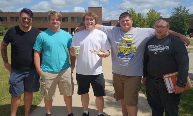 Winners of the tug-of-war on the Canton Campus were (from left) Kent Jarvis, Austin Brown, Chris Hueser, and Mike Fraser.