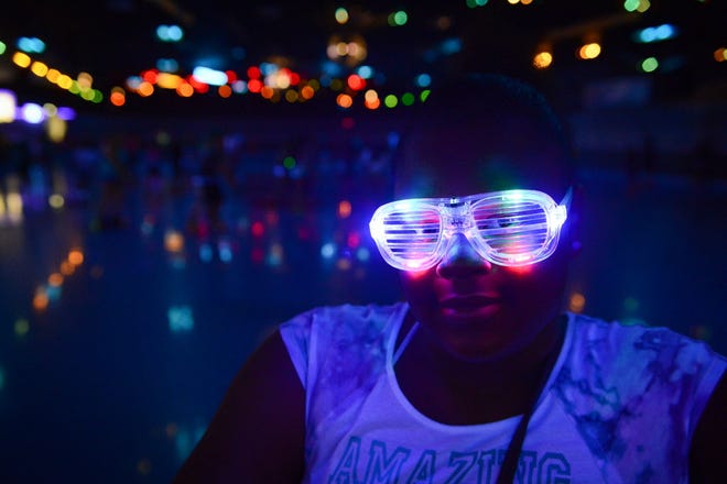 Ka'nesha Johnson, 10, wears blinking glasses for "Glow Skate" at Stardust Skate Center.