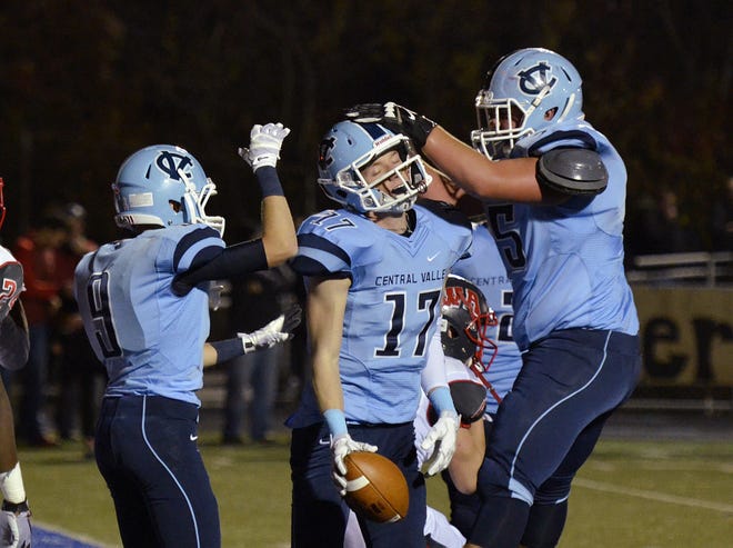 The Warriors' Dante Lucci (9) and Preston Cron (75) congratulate B.J. Powell (17) after a touchdown during Central Valley's 28-17 win over West Allegheny on Oct. 24, 2014, at Central Valley's Sarge Alberts Stadium. Cron, now a sophomore, was the starting center for a team that won the WPIAL Class AAA Championship and advanced the PIAA title game.