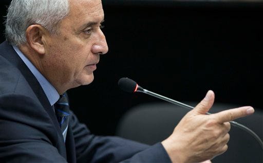 Guatemala's former president Otto Perez Molina makes his first statement in court in Guatemala City, Friday, Sept. 4, 2015, the day after his resignation first night as an ex-president in military custody. "The first thing I want to deny, I don't belong to 'la linea,'" Perez Molina said, referring to a fraud scheme. The court is considering allegations that the former leader was involved in a scheme in which businesspeople paid bribes to avoid import duties through Guatemala's customs agency. (AP Photo/Luis Soto)