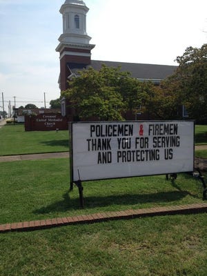 A sign in front of Covenant United Methodist Church promoting a lunch Thursday to thank emergency workers and police.