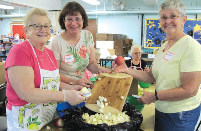 Top: Jeanine Jeffrey, Cathy McDonald and Annette Dillon, all from Leominster, peel apples for the homemade pies at last year’s bazaar. Below: Caroline Gelines, Doug Fife and Ainee Perkins, all from Leominster, serve pie and ice cream at last year’s bazaar.