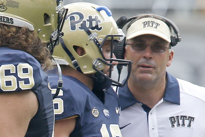 Pitt coach Pat Narduzzi, right, talks with quarterback Chad Voytik (16) during the season opener against Youngstown State.