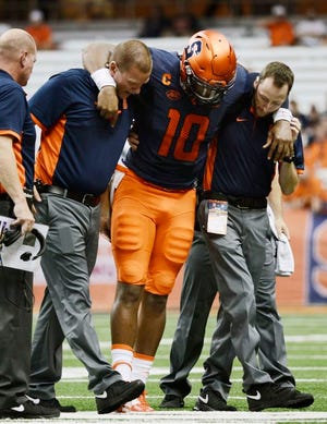 Syracuse's Terrel Hunt is helped off the field after injuring his Achilles tendon Friday against Rhode Island at the Carrier Dome in Syracuse. Hunt will miss the rest of the season.