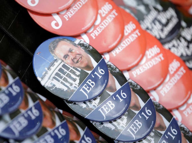 FILE - In this June 15, 2015, file photo, buttons are shown for sale outside Miami Dade College's Theodore Gibson Health Center in Miami, Monday, June 15, 2015, before Jeb Bush announced his bid for the Republican presidential nomination. It's been a tumultuous political summer. The unexpected rises of billionaire Donald Trump and socialist Bernie Sanders. Signs of weakness for Democratic front-runner Hillary Rodham Clinton. And in Ohio, one political veteran whose name did come up frequently was Bush _ but only in the context of rejecting the idea of electing a third Bush as president. (AP Photo/Wilfredo Lee, File)