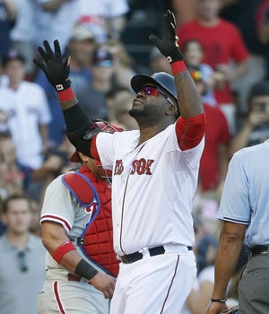 Red Sox designated hitter David Ortiz celebrates his 497th career home run, which helped the Red Sox defeat the Phillies, 6-2, Sunday to complete a three-game sweep. The Associated Press