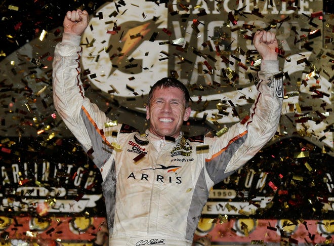 Carl Edwards celebrates in victory lane after winning the Sprint Cup race at Darlington Raceway on Sunday. The Associated Press