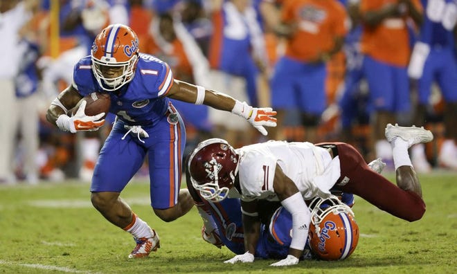 Vernon Hargreaves pulls in an interception during Florida's 61-13 win over New Mexico State on Saturday night.