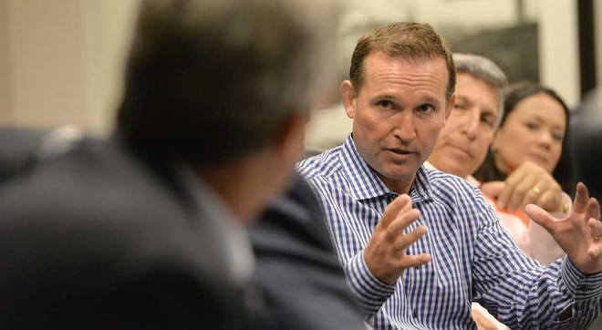 Bruce.Lipsky@jacksonville.com--07/02/15--Mayor Lenny Curry answers a question from one of the city council members. Jacksonville Mayor Lenny Curry brought the City Council together for an informal lunch in his conference room on Thursday, July 02, 2015 in City Hall. (Florida Times-Union, Bruce Lipsky)